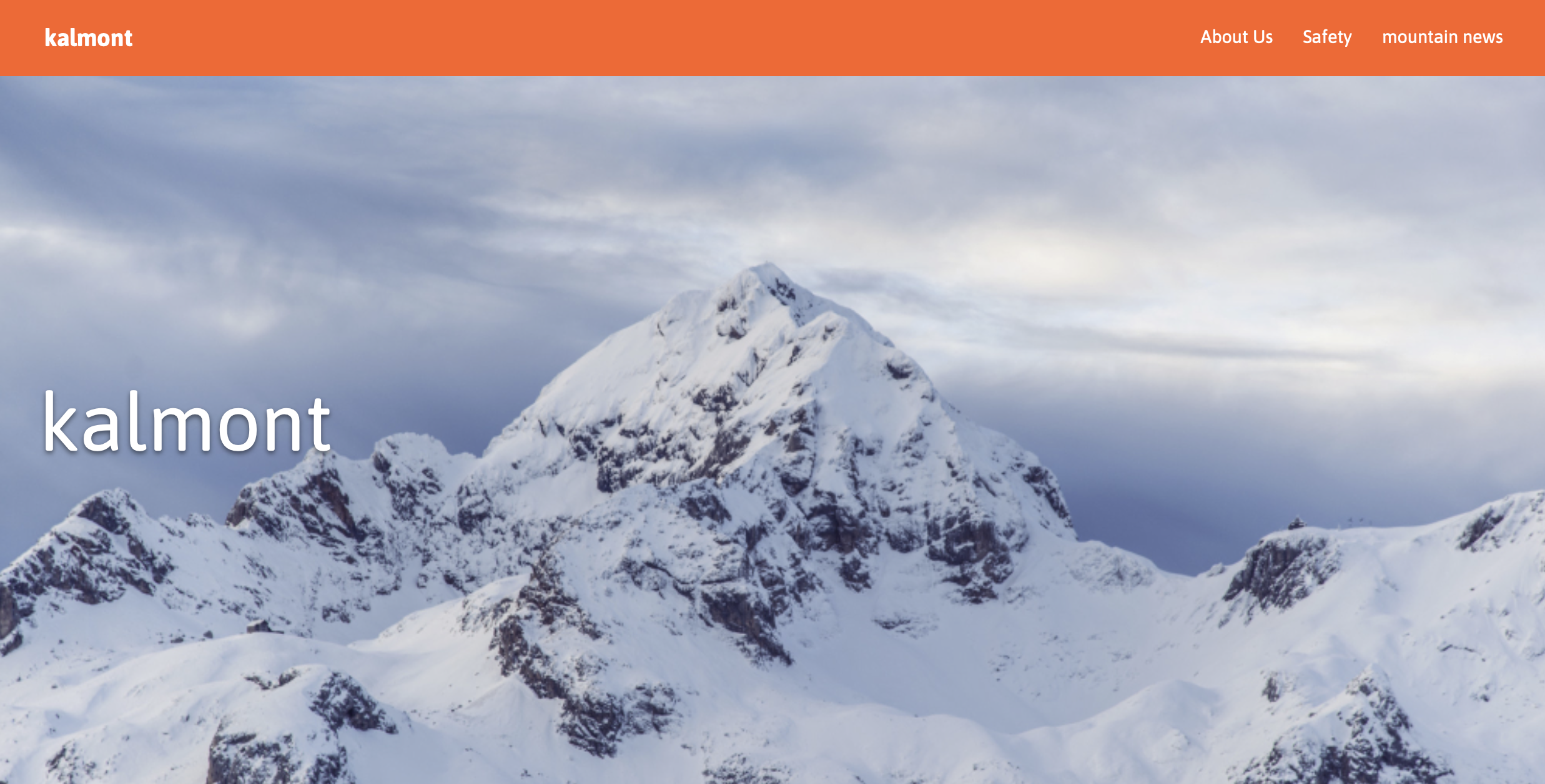 Kalmont - Snow-covered mountain peak with brand navigation